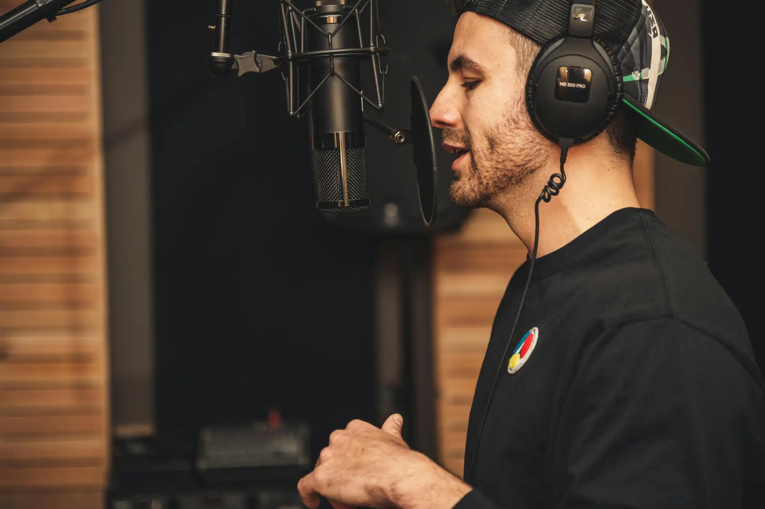 Black over-ear headphones with a matte finish and visible branding on the earcup.